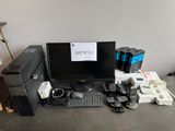 a computer desk with a lot of electronics on it