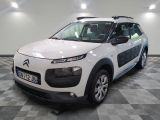 a picture of a white citrole car parked in a garage