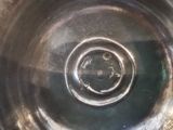 a close up of a metal object with a hole in it