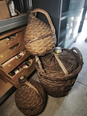 two wicker baskets sitting next to each other on the floor