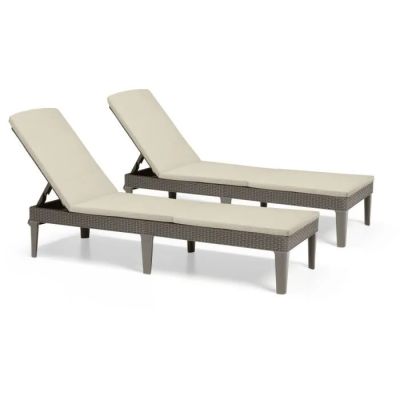 a pair of lounge chairs with beige cushions on a white background
