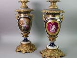 pair of antique vases with gold and blue decoration on them