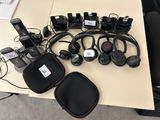 many headphones that are sitting on a table