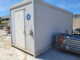 an image of a portable toilet in the middle of a construction site