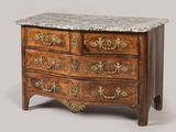 a marble top chest of drawers with a marble top