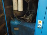 a blue cabinet with two cylinders of water in it