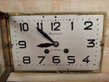 a clock that is on the wall with numbers on it