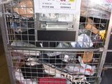 a metal cart with a bunch of items inside of it