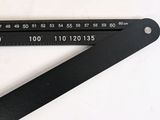a ruler and a ruler on a table next to a cardboard box