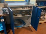 an image of a workbench in a room with a lot of clutter