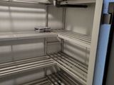 a refrigerator that has a lot of shelves in it