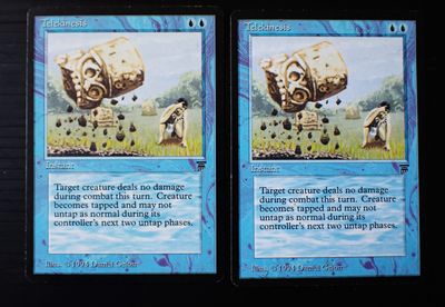 two cards with pictures of animals on them on a table