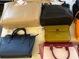 a lot of purses that are on a table
