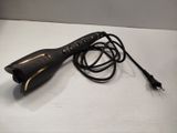 a cord that is connected to a hair dryer on a table
