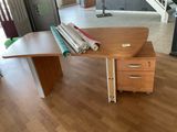 a desk with a file cabinet and a file cabinet on it