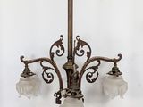 a chandelier with three lights hanging from the ceiling