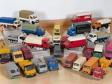 a lot of toy trucks that are on the floor