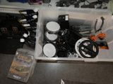 a plastic container filled with assorted items on the floor