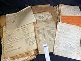 a lot of old papers on a table with a price tag
