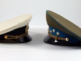 two hats sitting next to each other on a table