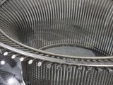 a close up of a metal basket on a table