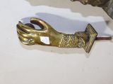 a pair of gold hands that are attached to a hook