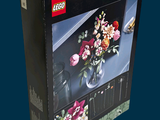 a black box with a picture of a vase of flowers in it