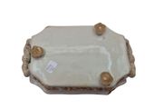 a white and gold plate with gold decorations on it