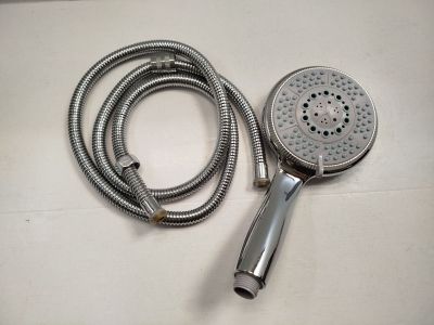 an image of a shower head and a shower hose