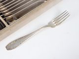 silverware in a wooden box with a fork and knife in it