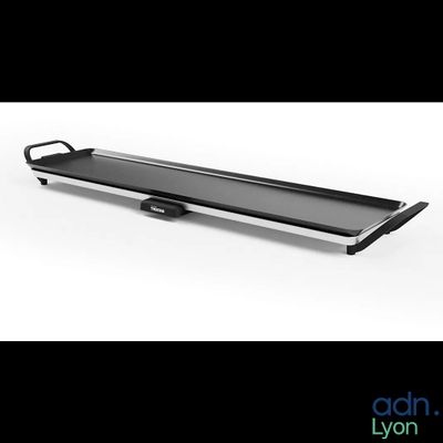 a close up of a metal tray with a handle on a white background