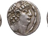 three ancient roman silver coins, one of which has a woman ' s face and the other of which is