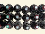 many bottles of wine stacked on top of each other
