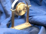 a clock that is sitting on top of a blue cloth