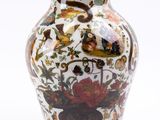 a vase with a floral design on it on a white background