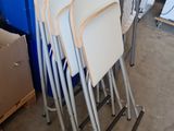 a lot of chairs that are sitting in a room