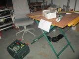 a workbench with tools on it in a garage