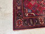 a rug on the floor with a cat sitting on top of it