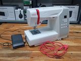 a sewing machine that is sitting on a wooden table