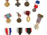 several medals are arranged in a circle on a white surface