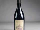 a bottle of wine that is sitting on a table