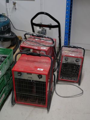 many different types of portable generators in a room