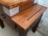 a wooden table with a drawer on top of it