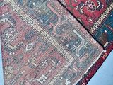 two rugs on the floor next to each other