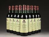 six bottles of wine are lined up in a row on a table