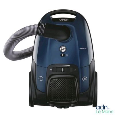 the vacuum is blue and black with a hose attached to it