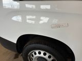 a close up of a white truck with a sticker on it ' s side