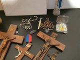 a table with a bunch of wooden crosses on it