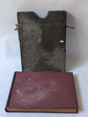 a book that is sitting on a table next to a bag
