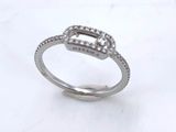 an image of a diamond ring on a white surface